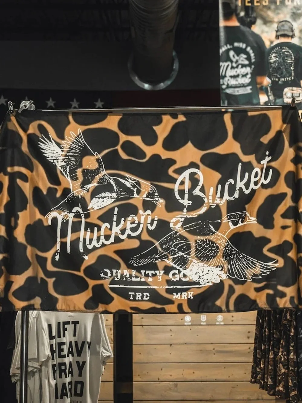 Mucker Bucket Camouflage Wall Tapestry in Tan & Black